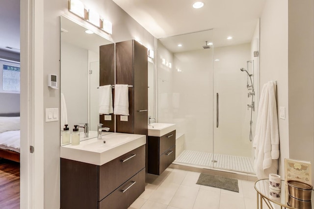 1800 N California Ave Unit 1E, Chicago, IL 60647 - full bath featuring a stall shower, two vanities, ensuite bathroom, tile patterned floors, and recessed lighting