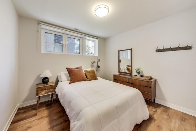 1800 N California Ave Unit 1E, Chicago, IL 60647 - bedroom featuring wood finished floors and baseboards