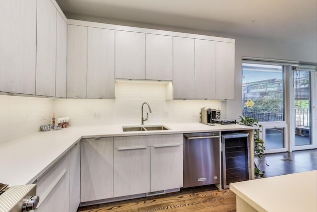 1800 N California Ave Unit 1E, Chicago, IL 60647 - kitchen featuring beverage cooler, stainless steel dishwasher, decorative backsplash, and light countertops
