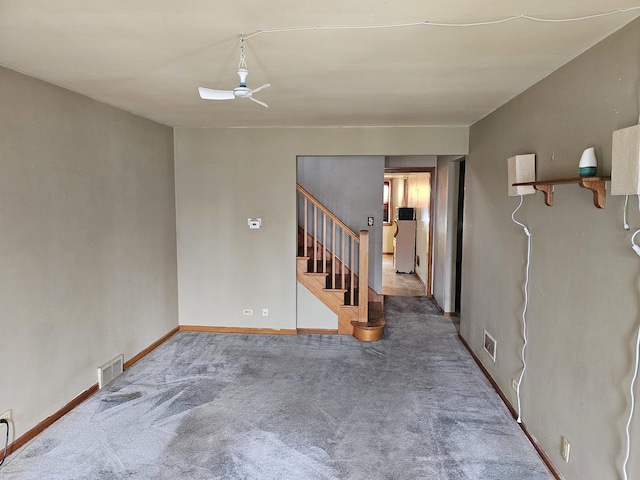 3711 W 68th Pl, Chicago, IL 60629 - empty room featuring stairway, ceiling fan, and carpet flooring