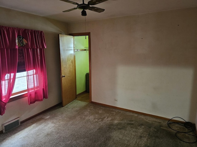 3711 W 68th Pl, Chicago, IL 60629 - carpeted empty room with a ceiling fan and baseboards