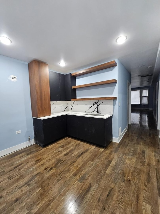 8809 S Lowe Ave, Chicago, IL 60620 - kitchen with open shelves, dark cabinetry, dark wood-style floors, light countertops, and modern cabinets