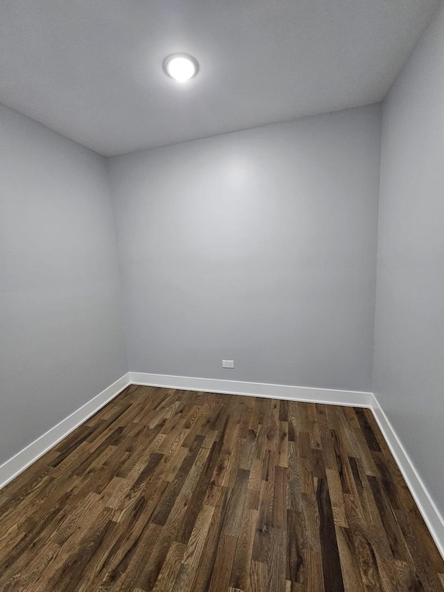8809 S Lowe Ave, Chicago, IL 60620 - spare room with dark wood-type flooring and baseboards