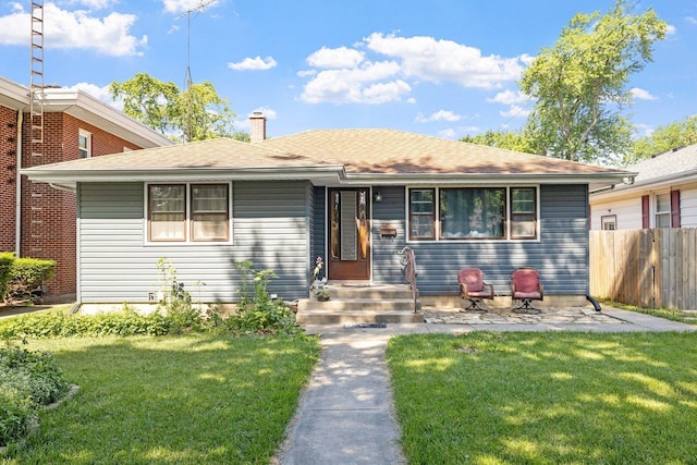 517 N William St, Joliet, IL 60435 - ranch-style home with a chimney and roof with shingles