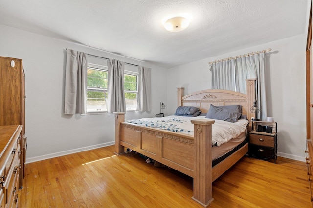 517 N William St, Joliet, IL 60435 - bedroom with light wood-style floors and baseboards