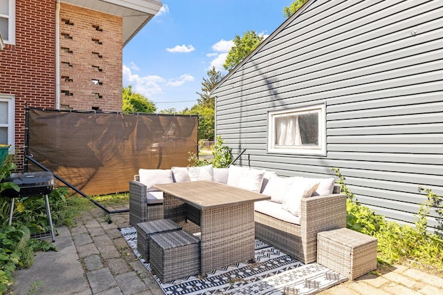 517 N William St, Joliet, IL 60435 - view of patio featuring a grill and an outdoor living space