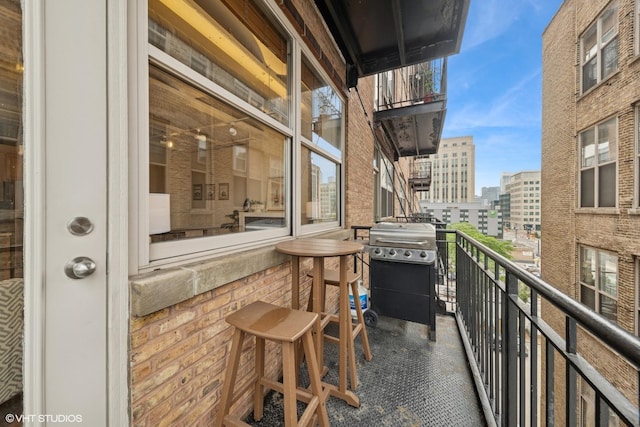 500 S Clinton St Unit 517, Chicago, IL 60607 - balcony featuring a city view and area for grilling