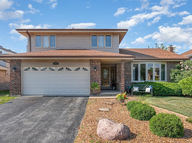 8712 Carriage Ln, Tinley Park, IL 60487 - traditional home featuring driveway, brick siding, an attached garage, and a chimney