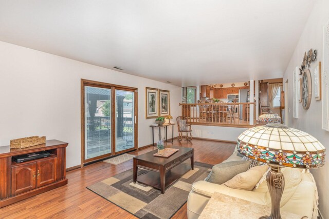 8712 Carriage Ln, Tinley Park, IL 60487 - living room with light wood finished floors and baseboards
