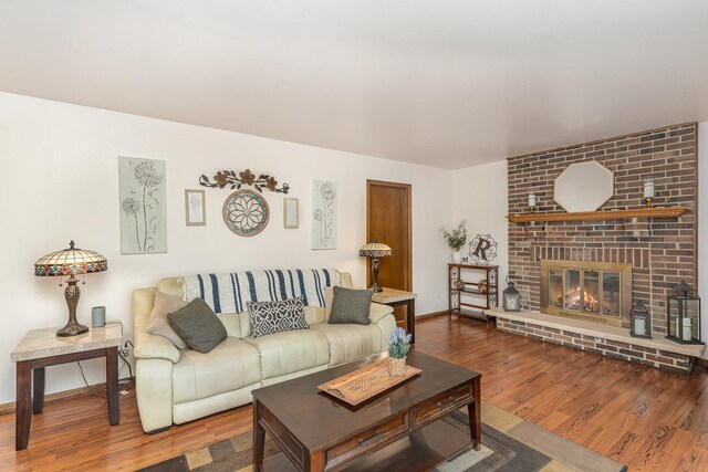 8712 Carriage Ln, Tinley Park, IL 60487 - living room with wood finished floors and a brick fireplace