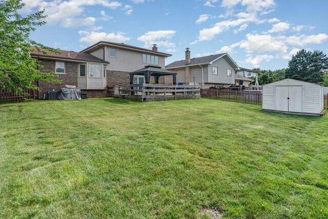 8712 Carriage Ln, Tinley Park, IL 60487 - fenced backyard featuring a gazebo and a storage shed