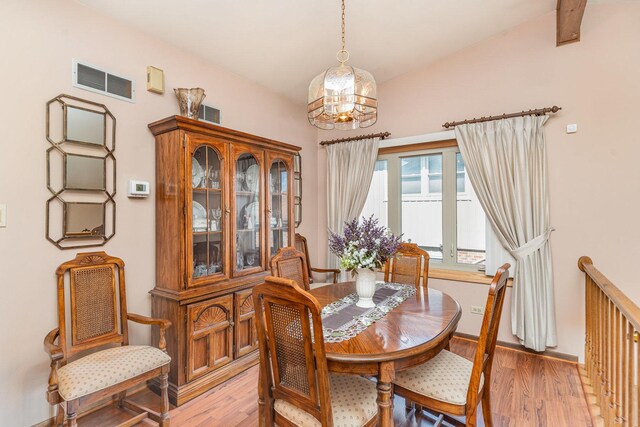 8712 Carriage Ln, Tinley Park, IL 60487 - dining space featuring light wood-style floors and a chandelier