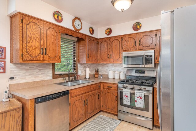 8712 Carriage Ln, Tinley Park, IL 60487 - kitchen with stainless steel appliances, light countertops, tasteful backsplash, and brown cabinets