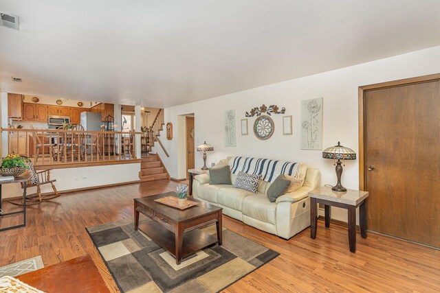 8712 Carriage Ln, Tinley Park, IL 60487 - living area featuring light wood-style flooring and stairway
