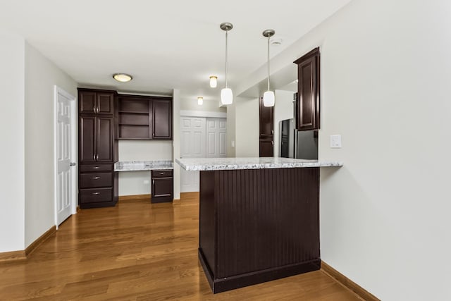 2909 N Sheridan Rd Unit 1601, Chicago, IL 60657 - kitchen featuring open shelves, fridge, built in desk, and dark brown cabinets