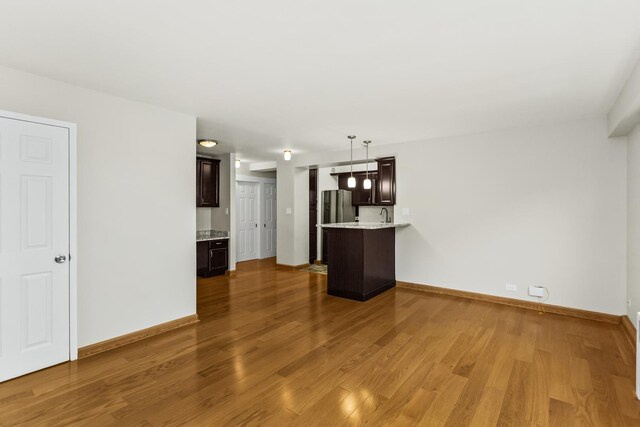 2909 N Sheridan Rd Unit 1601, Chicago, IL 60657 - unfurnished living room with wood finished floors and baseboards