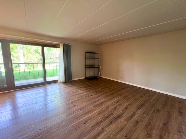 2310 Woodbridge Way Unit 1B, Lombard, IL 60148 - empty room with dark wood-style flooring and baseboards