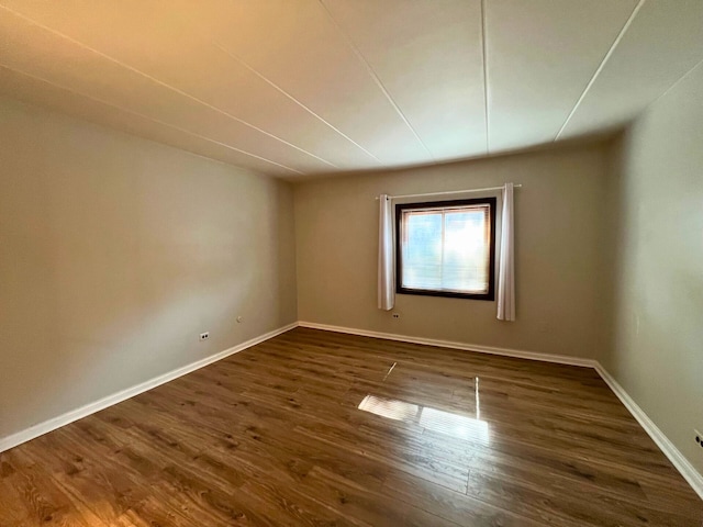 2310 Woodbridge Way Unit 1B, Lombard, IL 60148 - empty room with dark wood-style flooring and baseboards