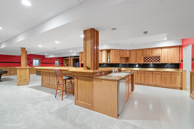 17 Ruffled Feathers Dr, Lemont, IL 60439 - kitchen featuring stainless steel dishwasher, open floor plan, wainscoting, a kitchen breakfast bar, and recessed lighting
