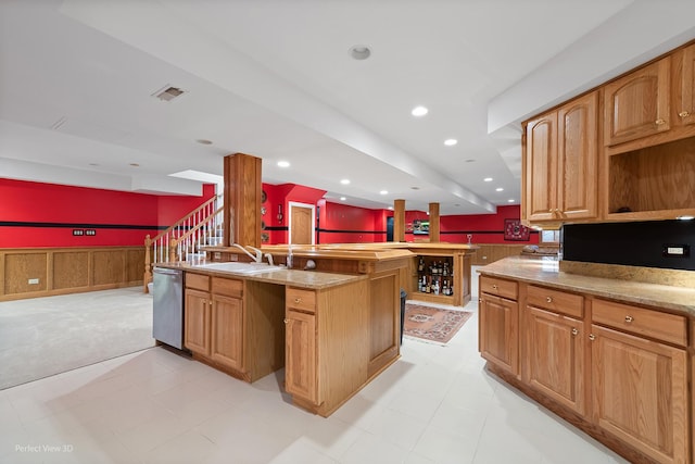 17 Ruffled Feathers Dr, Lemont, IL 60439 - kitchen with dishwasher, a wainscoted wall, a kitchen island with sink, open floor plan, and light stone countertops