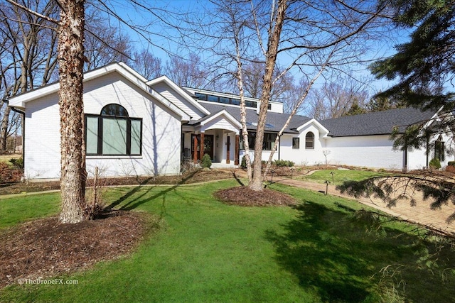 1417 Sherwood Ln, Geneva, IL 60134 - view of front facade with a front lawn and brick siding
