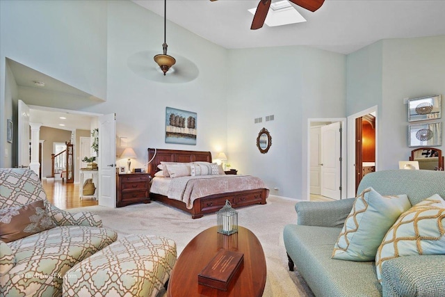 1417 Sherwood Ln, Geneva, IL 60134 - bedroom featuring a towering ceiling, light colored carpet, ornate columns, and ceiling fan