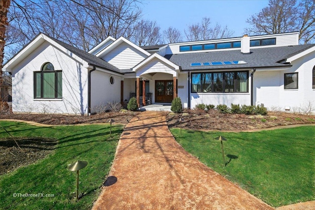 1417 Sherwood Ln, Geneva, IL 60134 - view of front of house with a shingled roof, brick siding, and a front lawn