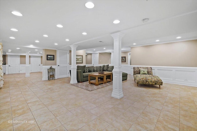 1417 Sherwood Ln, Geneva, IL 60134 - living area with ornate columns, a decorative wall, wainscoting, recessed lighting, and crown molding
