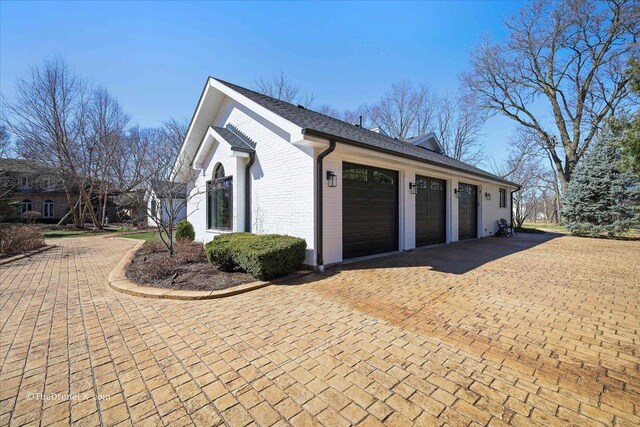 1417 Sherwood Ln, Geneva, IL 60134 - garage featuring decorative driveway