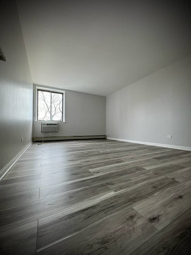 9720 S Pulaski Rd Unit 306, Oak Lawn, IL 60453 - additional living space with dark wood finished floors and a wall mounted air conditioner