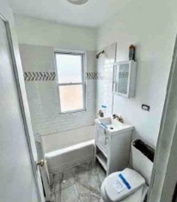 2626 W 96th Pl, Evergreen Park, IL 60805 - full bath featuring marble look tile flooring, bathing tub / shower combination, and vanity