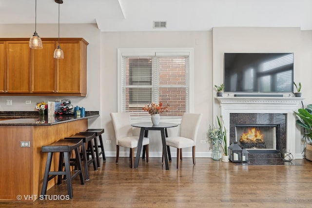 821 W Wrightwood Ave Unit 3, Chicago, IL 60614 - dining area with dark wood-style flooring, a high end fireplace, and healthy amount of natural light