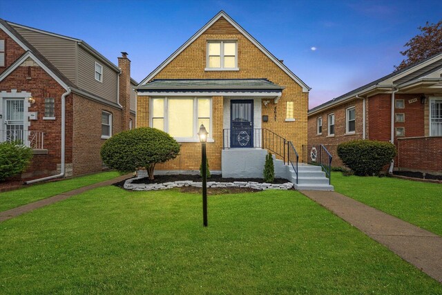 8637 S Honore St, Chicago, IL 60620 - view of front of home featuring brick siding and a yard