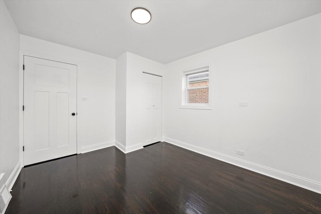 8637 S Honore St, Chicago, IL 60620 - unfurnished room featuring baseboards and dark wood finished floors