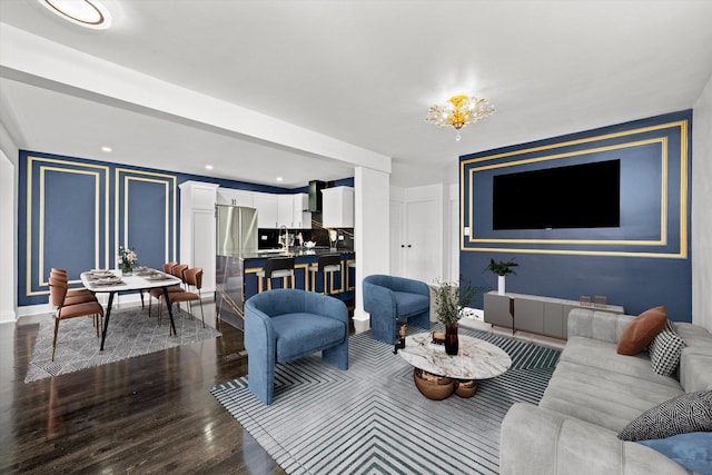 8637 S Honore St, Chicago, IL 60620 - living area featuring dark wood-style flooring and a chandelier