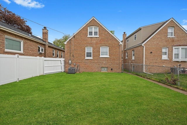 8637 S Honore St, Chicago, IL 60620 - rear view of property featuring brick siding and a fenced backyard