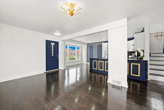 8637 S Honore St, Chicago, IL 60620 - entryway with wood finished floors, stairway, and a chandelier