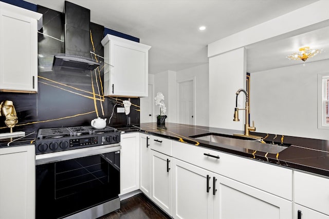 8637 S Honore St, Chicago, IL 60620 - kitchen with stainless steel range with gas cooktop, wall chimney exhaust hood, white cabinetry, dark wood-style floors, and tasteful backsplash