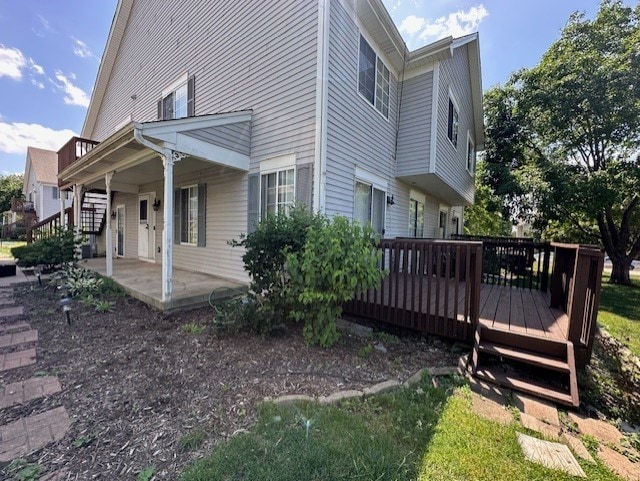 124 Village Creek Dr, Lake In The Hills, IL 60156 - view of side of home featuring a deck and a patio