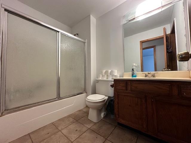 124 Village Creek Dr, Lake In The Hills, IL 60156 - bathroom featuring tile patterned flooring, vanity, and combined bath / shower with glass door