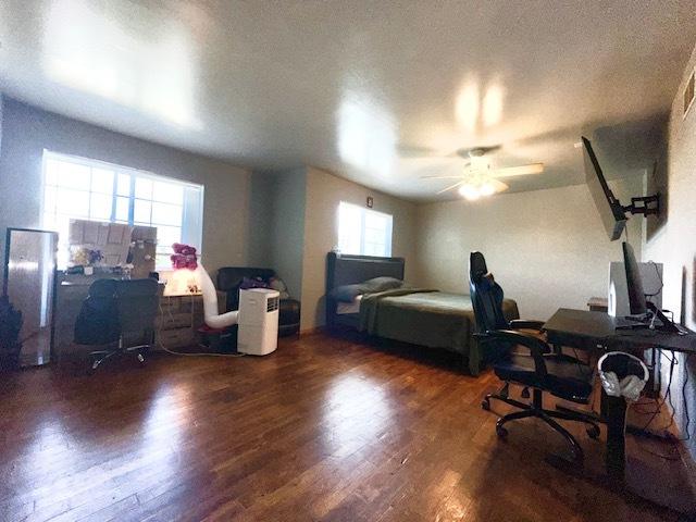 124 Village Creek Dr, Lake In The Hills, IL 60156 - bedroom featuring an office area, wood finished floors, and ceiling fan
