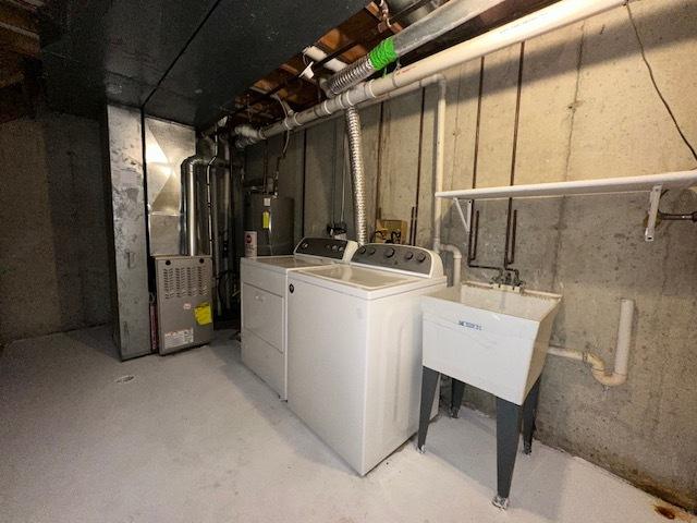 124 Village Creek Dr, Lake In The Hills, IL 60156 - unfinished basement with washing machine and clothes dryer, heating unit, and water heater