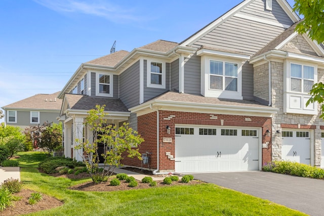 27W120 Timber Creek Dr, Winfield, IL 60190 - view of front of house with a garage, driveway, a shingled roof, and a front lawn