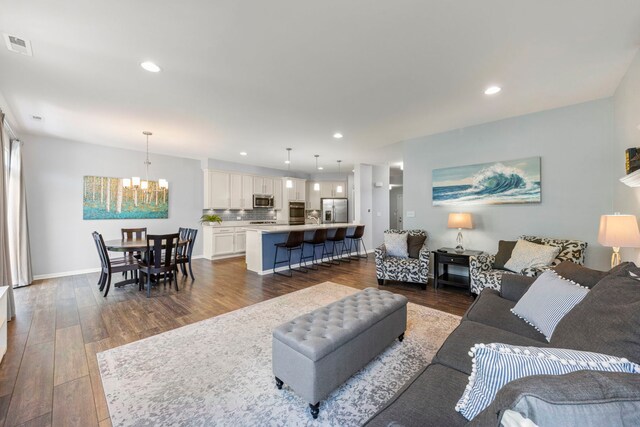 27W120 Timber Creek Dr, Winfield, IL 60190 - living area with a chandelier, dark wood-type flooring, and recessed lighting