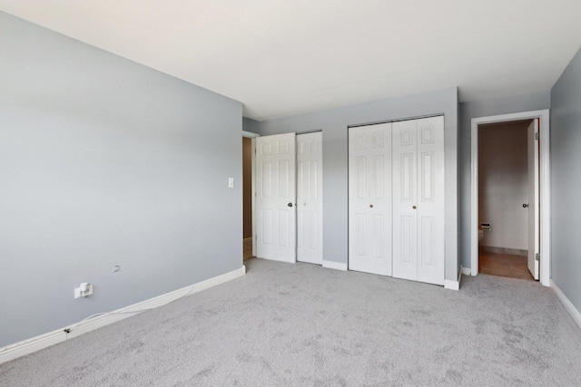 1320A Lore Ln Unit 204, Lombard, IL 60148 - unfurnished bedroom with multiple closets and carpet flooring