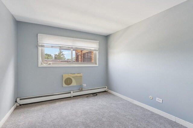 1320A Lore Ln Unit 204, Lombard, IL 60148 - carpeted empty room with a baseboard radiator and an AC wall unit