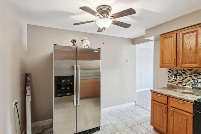 1320A Lore Ln Unit 204, Lombard, IL 60148 - kitchen with stainless steel fridge with ice dispenser, a ceiling fan, backsplash, brown cabinetry, and light tile patterned flooring