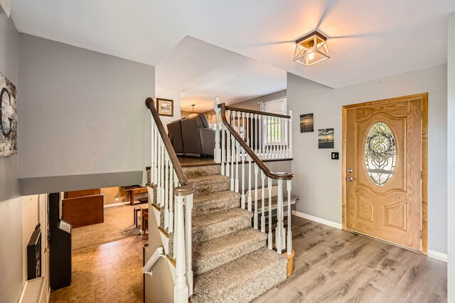 905 Harrison Ln, Hoffman Estates, IL 60192 - foyer entrance featuring stairway and wood finished floors