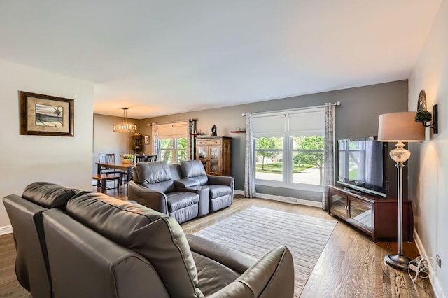 905 Harrison Ln, Hoffman Estates, IL 60192 - living area with wood finished floors and a chandelier