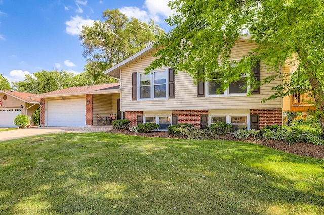905 Harrison Ln, Hoffman Estates, IL 60192 - tri-level home featuring brick siding, a garage, a front yard, and concrete driveway
